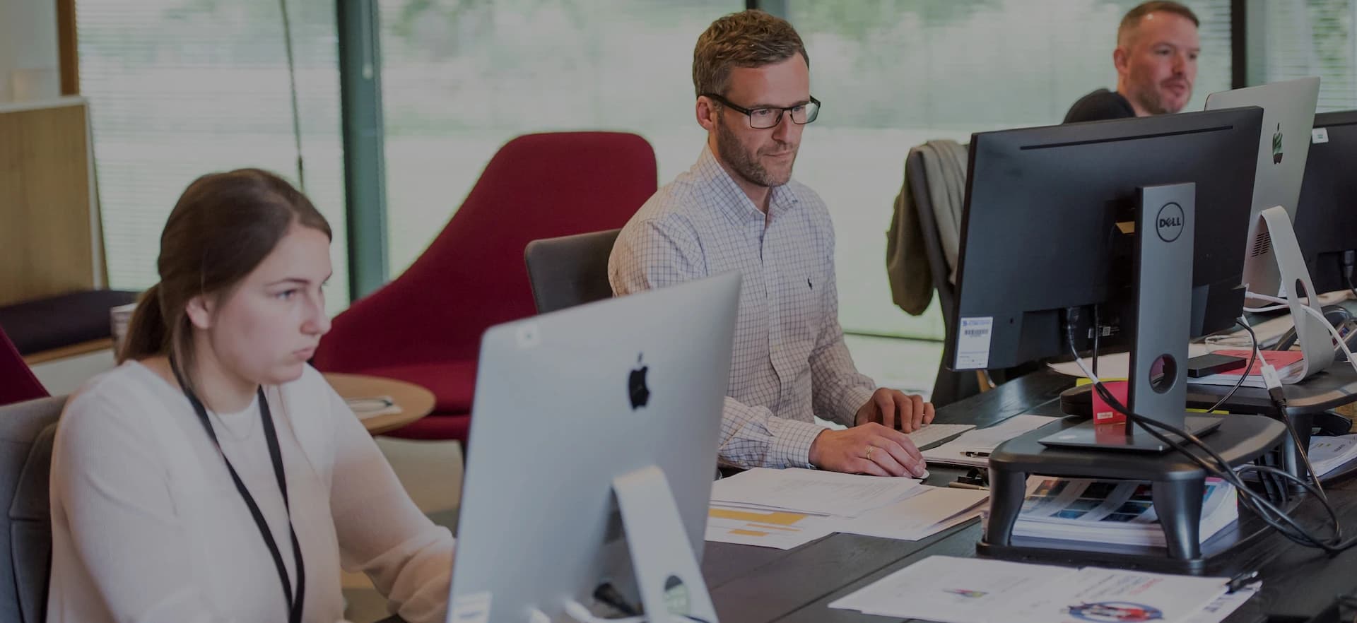 Inscribe BPO team members working at their desks