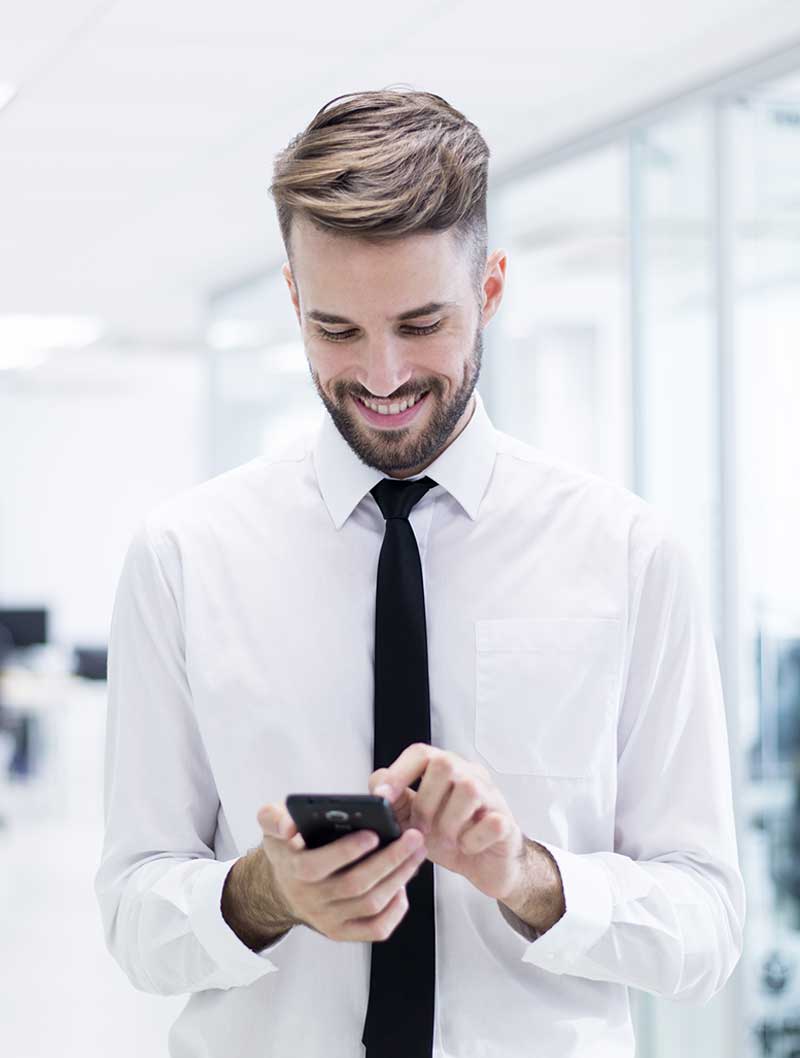 Consultant reviewing a case on his phone